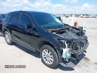2014 Mazda CX-5 Sport with VIN JM3KE2BE9E0402015, listed as a IAAI auction lot 42098197 with 65,328 mi miles and . Bid and sale history available at carsss.com. Image 1.