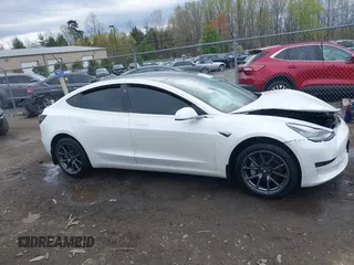 2019 Tesla Model 3 Mid Range with VIN 5YJ3E1EA5KF397098, listed as a IAAI auction lot 41943570 with 72,046 mi miles and . Bid and sale history available at DreamBid. Image 13.