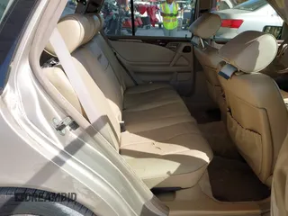 1999 Mercedes-Benz E-Class with VIN WDBJH65F3XA845635, listed as a IAAI auction lot 42102122 with 215,678 mi miles. Bid and sale history available at carsss.com. Image 8.