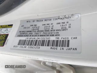 2021 Mazda 3 Premium with VIN JM1BPAML0M1302385, listed as a IAAI auction lot 41397521 with 55,907 mi miles and . Bid and sale history available at DreamBid. Image 9.