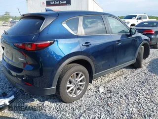2023 Mazda CX-5 S Preferred with VIN JM3KFBCM1P0260992, listed as a IAAI auction lot 42192977 with 22,445 mi miles and . Bid and sale history available at carsss.com. Image 4.