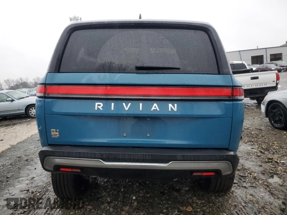 2024 Rivian R1S Adventure z VIN 7PDSGABA1RN031444, wystawiony jako Copart lot #43312765 z przebiegiem Nie podano mil oraz Szkody całkowita. Historia ofert i sprzedaży dostępna na DreamBid. Obrazek 6.