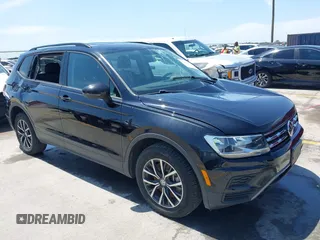2021 Volkswagen Tiguan S with VIN 3VV1B7AX9MM067347, listed as a IAAI auction lot 42305101 with 77,042 mi miles and . Bid and sale history available at DreamBid. Image 1.