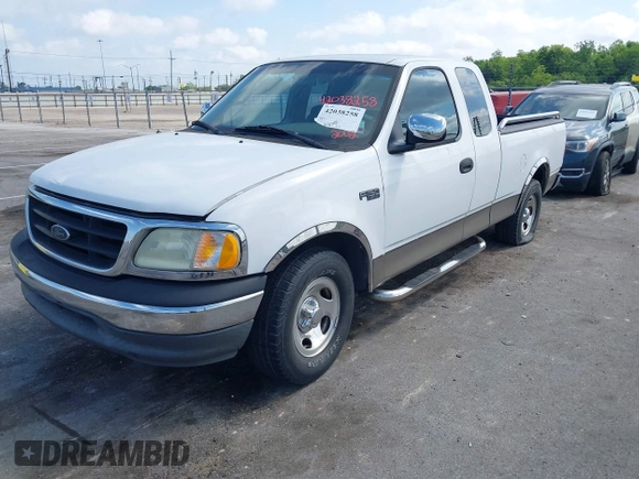 2002 Ford F-150 XL with VIN 1FTRX17242NA69697, listed as a IAAI auction lot 42038258 with 207,008 mi miles. Bid and sale history available at carsss.com. Image 2.