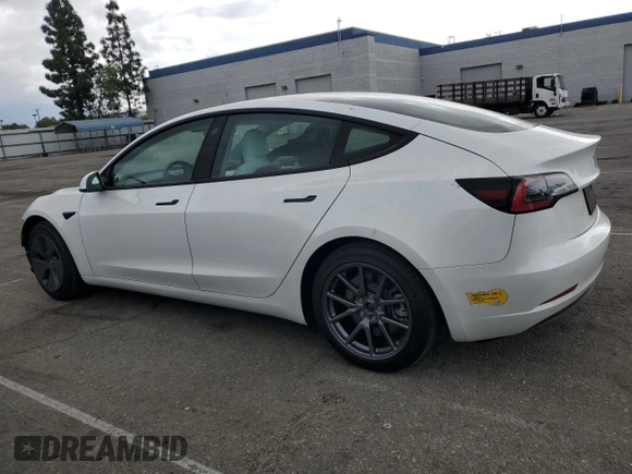 2021 Tesla Model 3 Standard Range Plus with VIN 5YJ3E1EA6MF066064, listed as a Copart auction lot 54063625 with 27,424 mi miles and Salvage Title. Bid and sale history available at DreamBid. Image 2.