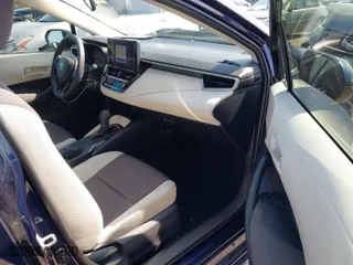 2024 Toyota Corolla Hybrid LE with VIN JTDBCMFE4RJ021466, listed as a IAAI auction lot 41976149 with 21,965 mi miles. Bid and sale history available at carsss.com. Image 5.