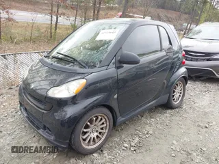 2009 Smart fortwo Pure with VIN WMEEJ31X69K244948, listed as a IAAI auction lot 41925643 with 129,877 mi miles and . Bid and sale history available at DreamBid. Image 2.