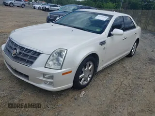 2010 Cadillac STS AWD z VIN 1G6DU6EV4A0102872, wystawiony jako IAAI lot #42348505 z przebiegiem 151 934 mil mil oraz . Historia ofert i sprzedaży dostępna na DreamBid. Obrazek 2.