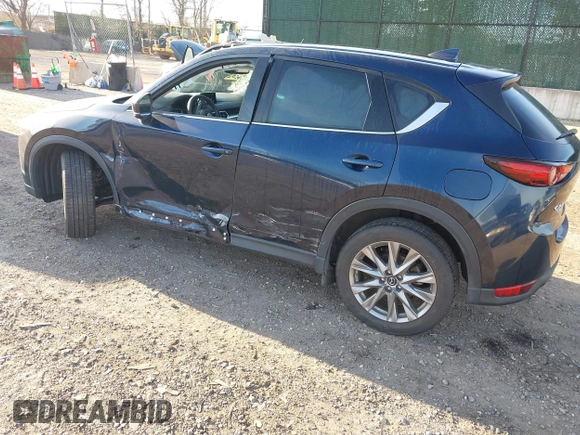 2020 Mazda CX-5 Grand Touring with VIN JM3KFBDM4L0779284, listed as a IAAI auction lot 42060936 with 9,227 mi miles. Bid and sale history available at carsss.com. Image 3.