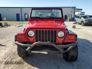1999 Jeep Wrangler SE with VIN 1J4FY29P8XP483909, listed as a Copart auction lot 48679555 with 168,708 mi miles and Salvage title. Bid and sale history available at DreamBid. Image 5.