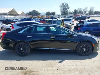 2013 Cadillac XTS Luxury z VIN 2G61P5S30D9220113, wystawiony jako IAAI lot #41970214 z przebiegiem 52 476 mil mil oraz . Historia ofert i sprzedaży dostępna na DreamBid. Obrazek 13.