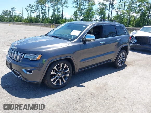 2017 Jeep Grand Cherokee Overland with VIN 1C4RJFCG2HC641791, listed as a IAAI auction lot 42566654 with 116,764 mi miles and . Bid and sale history available at DreamBid. Image 17.
