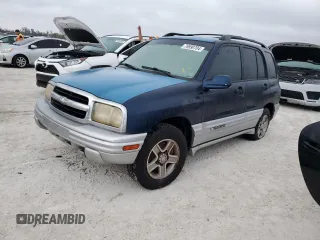 2002 Chevrolet Tracker LT with VIN 2CNBE634126928532, listed as a Copart auction lot 76990704 with Not provided miles and Salvage title. Bid and sale history available at DreamBid. Image 1.