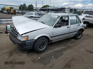 1986 Toyota Corolla с VIN JT2AE82E7G3353012, выставлен на аукционе Copart как лот 68646544 с пробегом 176 256 миль миль и Чистый • Clean title. История ставок и продаж доступна на DreamBid. Изображение 1.