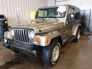 2003 Jeep Wrangler Sahara z VIN 1J4FA59S83P343234, wystawiony jako IAAI lot #41644074 z przebiegiem 197 461 mil mil oraz . Historia ofert i sprzedaży dostępna na DreamBid. Obrazek 2.