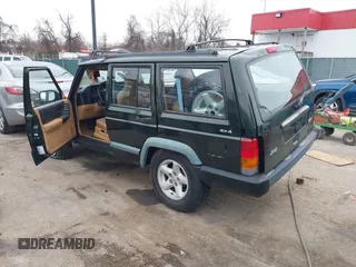 1997 Jeep Cherokee Sport with VIN 1J4FJ68SXVL582060, listed as a IAAI auction lot 41333519 with 183,580 mi miles. Bid and sale history available at carsss.com. Image 3.