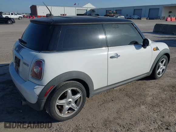 2009 MINI Cooper Hardtop with VIN WMWMF33569TZ20989, listed as a IAAI auction lot 41994772 with 152,944 mi miles. Bid and sale history available at carsss.com. Image 4.
