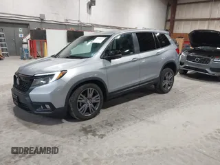 2021 Honda Passport EX-L with VIN 5FNYF8H56MB000107, listed as a IAAI auction lot 41868429 with 66,572 mi miles and . Bid and sale history available at DreamBid. Image 2.