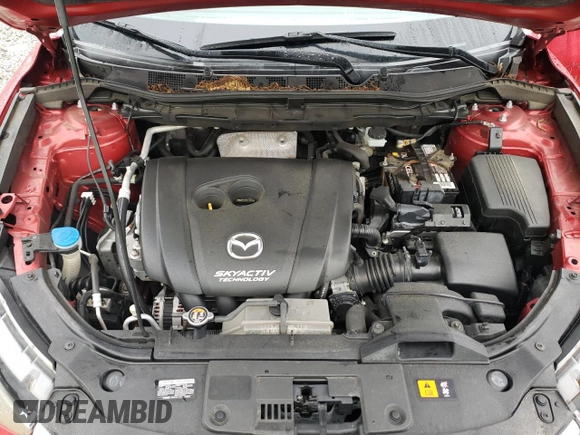 2016 Mazda CX-5 Grand Touring z VIN JM3KE2DY8G0623423, wystawiony jako Copart lot #58599545 z przebiegiem 131 932 mil mil oraz Szkoda całkowita • Salvage title. Historia ofert i sprzedaży dostępna na DreamBid. Obrazek 12.