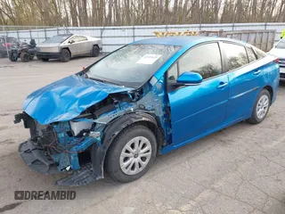 2021 Toyota Prius L Eco with VIN JTDKAMFU5M3145949, listed as a IAAI auction lot 42113123 with 127,872 mi miles and . Bid and sale history available at DreamBid. Image 2.