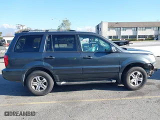 2003 Honda Pilot EX with VIN 2HKYF18633H599550, listed as a IAAI auction lot 41813549 with 242,103 mi miles. Bid and sale history available at carsss.com. Image 14.