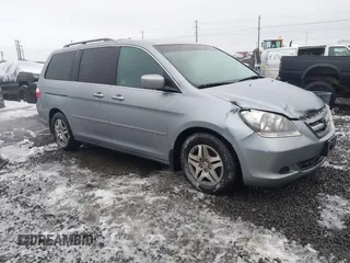 2007 Honda Odyssey EX-L z VIN 5FNRL38647B033863, wystawiony jako IAAI lot #41563291 z przebiegiem 104 507 mil mil oraz . Historia ofert i sprzedaży dostępna na DreamBid. Obrazek 1.