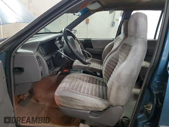 1994 Jeep Grand Cherokee Laredo with VIN 1J4FX58S0RC316030, listed as a Copart auction lot 66178754 with 281,785 mi miles and Salvage Title. Bid and sale history available at carsss.com. Image 7.