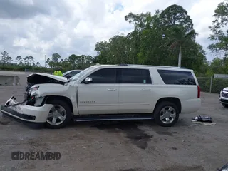 2015 Chevrolet Suburban LTZ with VIN 1GNSKKKC4FR687923, listed as a IAAI auction lot 42192062 with 139,873 mi miles and . Bid and sale history available at DreamBid. Image 14.