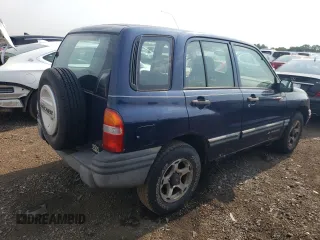 2001 Chevrolet Tracker z VIN 2CNBJ13C616955326, wystawiony jako Copart lot #64105184 z przebiegiem 138 156 mil mil oraz Tytuł czysty. Historia ofert i sprzedaży dostępna na DreamBid. Obrazek 3.