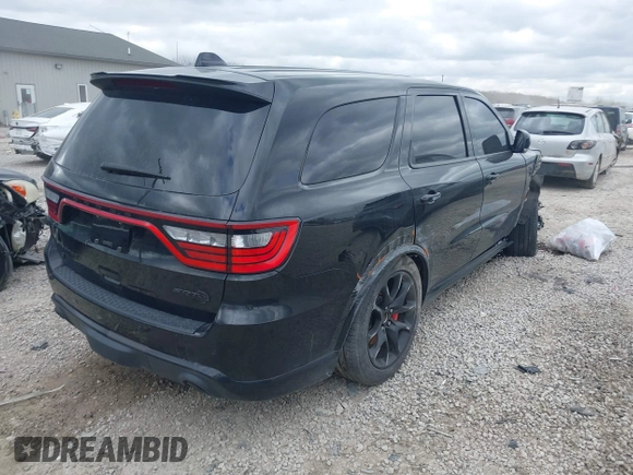 2021 Dodge Durango SRT Hellcat with VIN 1C4SDJH91MC682235, listed as a IAAI auction lot 42029380 with 9,921 mi miles and . Bid and sale history available at DreamBid. Image 4.