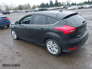 2015 Ford Focus Titanium with VIN 1FADP3N2XFL300859, listed as a IAAI auction lot 41944410 with 76,194 mi miles. Bid and sale history available at carsss.com. Image 3.