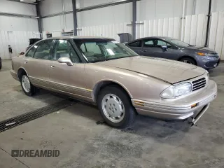 1995 Oldsmobile LSS z VIN 1G3HY5215SH307862, wystawiony jako Copart lot #69297244 z przebiegiem 129 142 mil mil oraz Szkody całkowita. Historia ofert i sprzedaży dostępna na DreamBid. Obrazek 4.