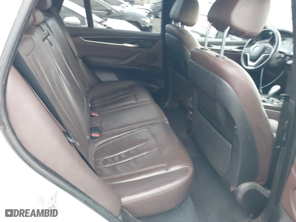 2018 BMW X5 xDrive40e iPerformance with VIN 5UXKT0C58J0V99415, listed as a IAAI auction lot 41391474 with 124,671 mi miles. Bid and sale history available at carsss.com. Image 8.
