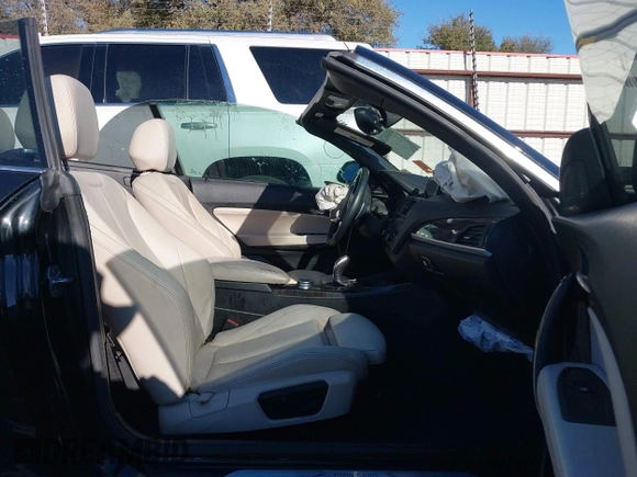 2015 BMW 2 Series 228i with VIN WBA1K5C57FV473826, listed as a IAAI auction lot 41866820 with 130,823 mi miles. Bid and sale history available at carsss.com. Image 5.