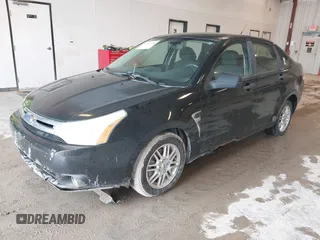 2009 Ford Focus SE with VIN 1FAHP35N69W128084, listed as a IAAI auction lot 42202678 with 290,358 mi miles. Bid and sale history available at carsss.com. Image 2.