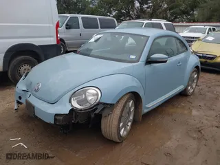 2012 Volkswagen Beetle 2.5L PZEV with VIN 3VWJP7AT0CM624851, listed as a IAAI auction lot 41364230 with 1 mi miles. Bid and sale history available at carsss.com. Image 2.