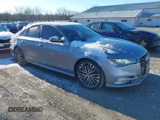 2016 Audi A6 Premium Plus z VIN WAUGFAFC5GN084072, wystawiony jako IAAI lot #41735811 z przebiegiem 102 437 mil mil oraz . Historia ofert i sprzedaży dostępna na DreamBid. Obrazek 1.