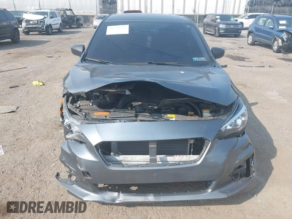 2018 Subaru Impreza with VIN 4S3GTAA63J3748319, listed as a IAAI auction lot 42441310 with 71,616 mi miles and . Bid and sale history available at DreamBid. Image 12.