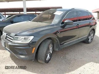 2020 Volkswagen Tiguan SE z VIN 3VV3B7AX7LM039084, wystawiony jako IAAI lot #42249016 z przebiegiem 126 763 mil mil oraz . Historia ofert i sprzedaży dostępna na DreamBid. Obrazek 18.