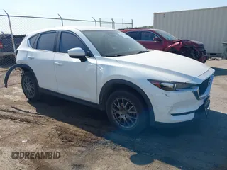 2017 Mazda CX-5 Sport with VIN JM3KFABL5H0124725, listed as a IAAI auction lot 40487298 with 103,889 mi miles. Bid and sale history available at carsss.com. Image 1.