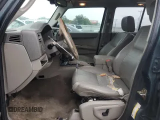 2006 Jeep Commander with VIN 1J8HH48NX6C125803, listed as a Copart auction lot 71247304 with 214,297 mi miles and Salvage Title. Bid and sale history available at carsss.com. Image 7.
