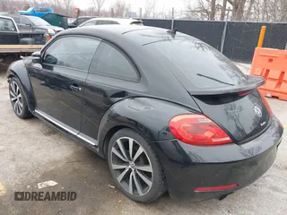 2012 Volkswagen Beetle 2.0T Turbo PZEV with VIN 3VWVA7AT1CM635697, listed as a IAAI auction lot 41552112 with 150,689 mi miles. Bid and sale history available at carsss.com. Image 2.