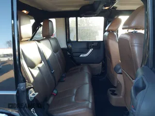 2014 Jeep Wrangler Unlimited Sahara with VIN 1C4BJWEG7EL322316, listed as a IAAI auction lot 41059508 with 144,662 mi miles. Bid and sale history available at carsss.com. Image 8.
