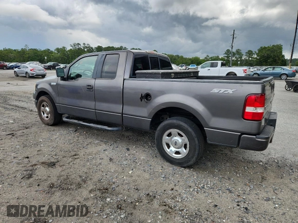 2005 Ford F-150 STX with VIN 1FTRX12W55FB32573, listed as a Copart auction lot 59602715 with 238,701 mi miles and Salvage title. Bid and sale history available at DreamBid. Image 2.