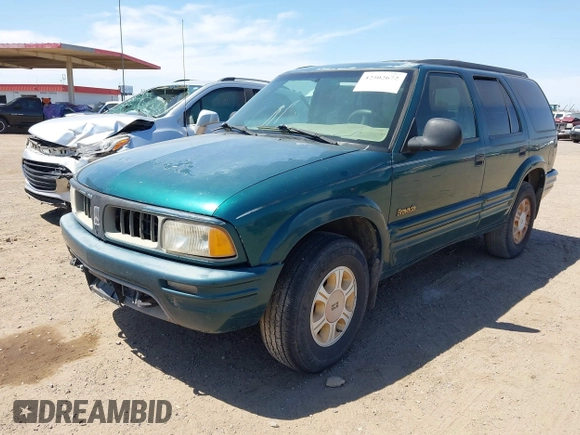 1996 Oldsmobile Bravada z VIN 1GHDT13W5T2711291, wystawiony jako IAAI lot #42502672 z przebiegiem 219 062 mil mil oraz . Historia ofert i sprzedaży dostępna na DreamBid. Obrazek 2.
