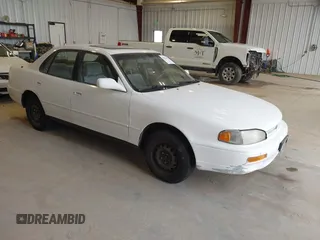 1996 Toyota Camry DX with VIN JT2BG12K3T0401659, listed as a IAAI auction lot 41874795 with 169,406 mi miles. Bid and sale history available at carsss.com. Image 1.