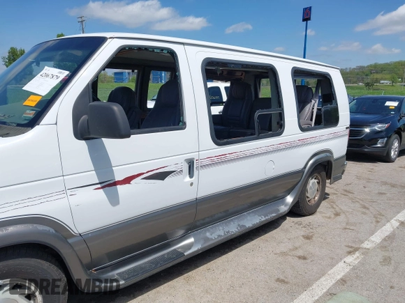 1999 Ford Econoline Cargo Recreational with VIN 1FDRE14L2XHA41059, listed as a IAAI auction lot 42067879 with 149,185 mi miles. Bid and sale history available at carsss.com. Image 6.