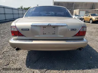 1999 Jaguar XJ with VIN SAJKD6042XC876937, listed as a Copart auction lot 66366064 with 121,747 mi miles and Clean Title. Bid and sale history available at carsss.com. Image 6.