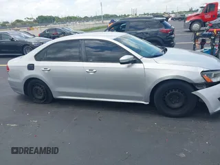 2014 Volkswagen Passat S with VIN 1VWAS7A38EC028292, listed as a IAAI auction lot 42357817 with 151,695 mi miles and . Bid and sale history available at DreamBid. Image 14.