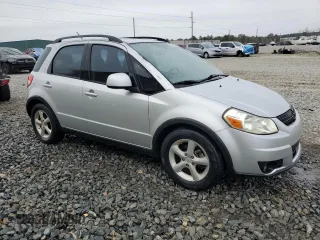 2009 Suzuki SX4 with VIN JS2YB413195101423, listed as a Copart auction lot 85321624 with 127,917 mi miles and Salvage Title. Bid and sale history available at carsss.com. Image 4.